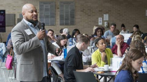 Adelric McCain, director of impact and equity for the Network for College Success, provides professional development to high school educators on how to improve grades for ninth-graders—a key indicator for graduation and postsecondary enrollment.